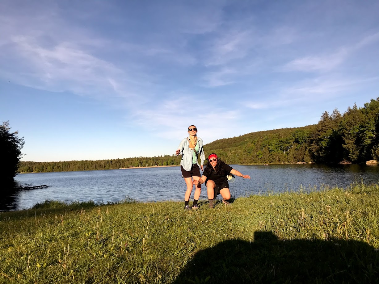 julie and michelle with a lake and mountains behind